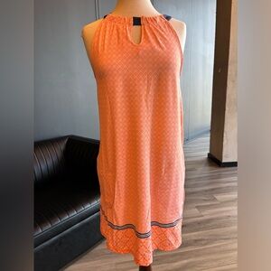 Sleeveless dress in soft orange & white pattern